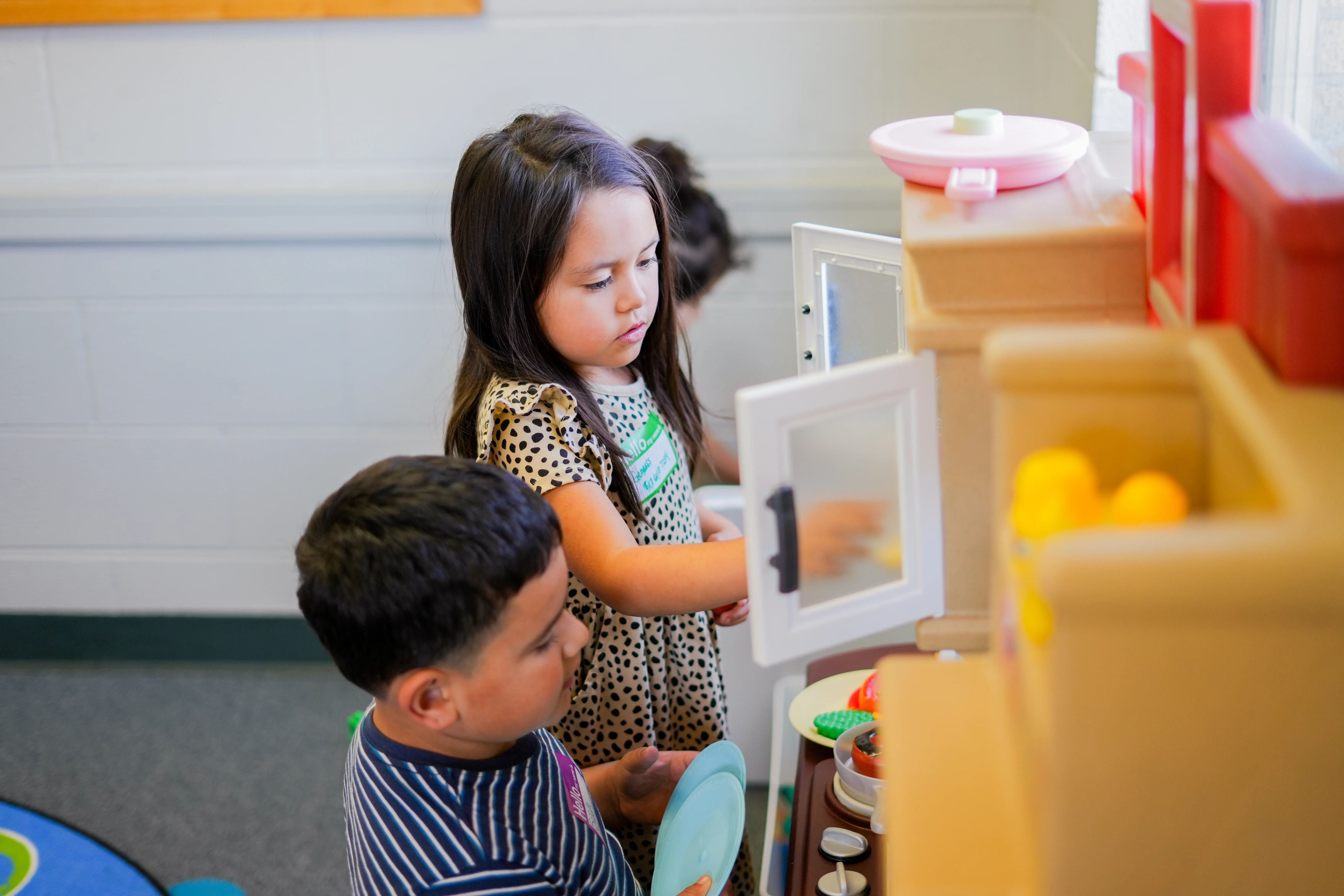 Children playing in kitchen area