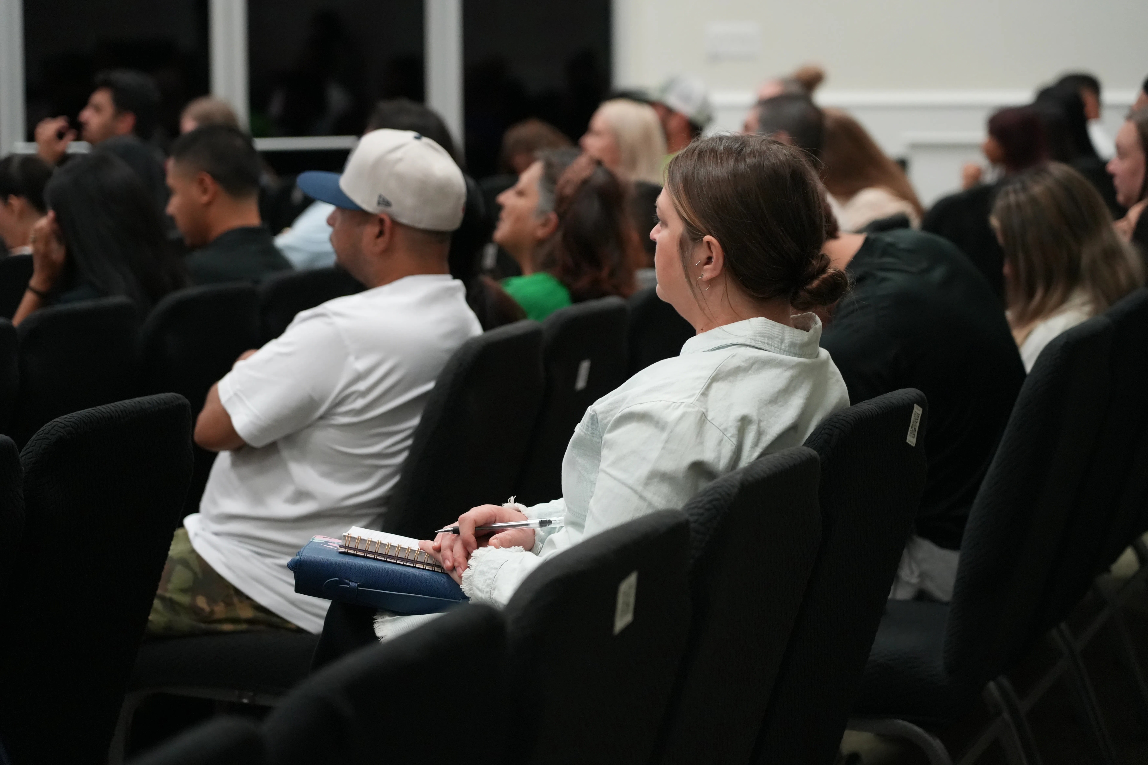 Woman listening to sermon